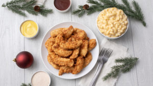 Holiday catering table spread with chicken tenders and mac & cheese